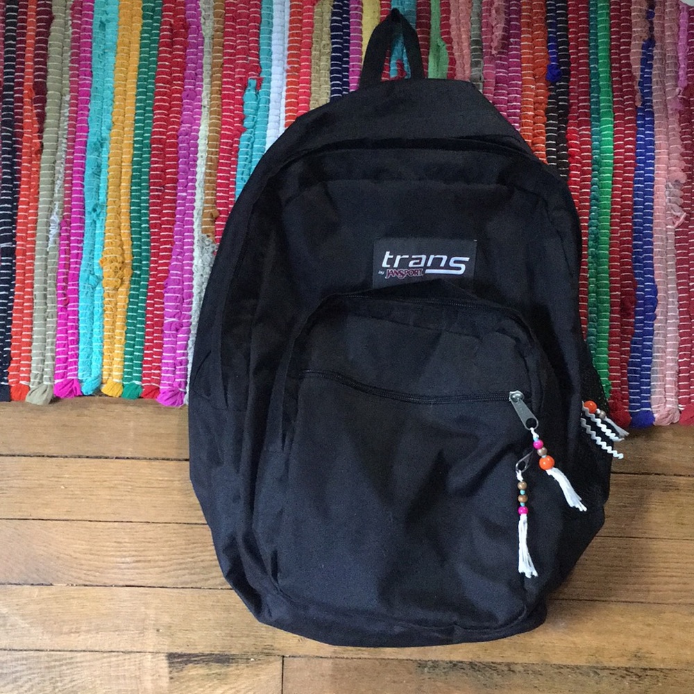 Standard black trans jansport backpack.